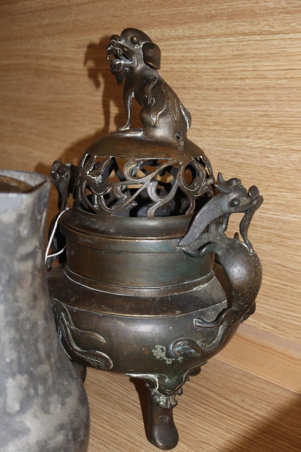 A 19th century Chinese bronze koro, with pierced cover, dragon handles and Dog of Fo finial, Xuande mark and sundry metalware